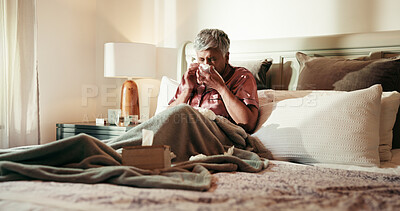 Buy stock photo Senior, sick woman and blowing nose with tissue on bed for influenza or viral infection at home. Female person, virus and cold with flu, sinus or hayfever in bedroom for germs, bacteria or sneeze