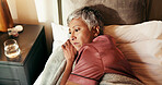 Thinking, tired and sad with old woman in bed for insomnia, reflection and retirement. Fatigue, sleeping pills and memory with above of senior person in bedroom of home for mental health and idea