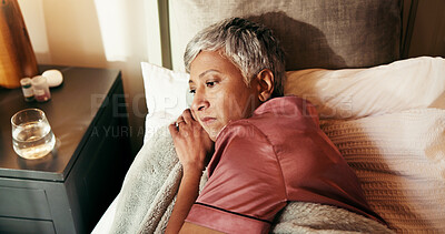 Buy stock photo Thinking, tired and sad with old woman in bed for insomnia, reflection and retirement. Fatigue, sleeping pills and memory with above of senior person in bedroom of home for mental health and rest