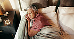 Senior woman, sleeping and above in bed with blanket for warmth or cozy comfort at home. Top view, mature or tired female person asleep in bedroom with duvet or sheet for rest, break or nap at house