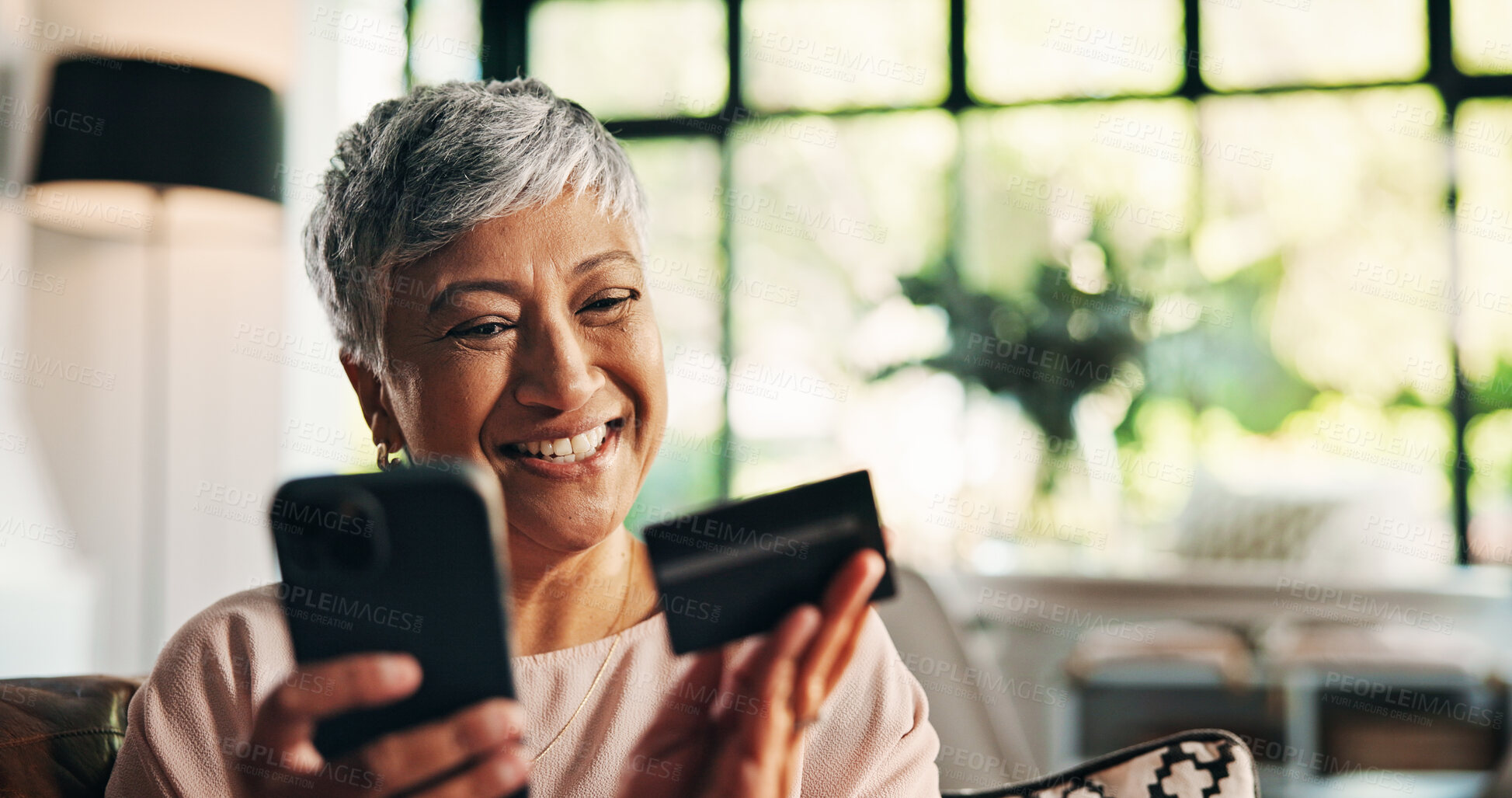 Buy stock photo Mature woman, phone and credit card with smile, excited and discount for ecommerce, sale or home. Person, smartphone or mobile app for fintech, bonus or easy payment for online shopping at house