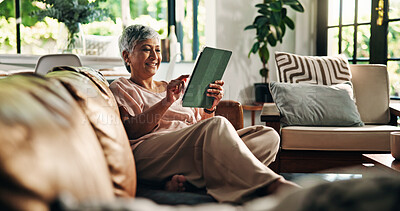 Buy stock photo Senior, woman or scroll with tablet on sofa for online gaming, gambling app or internet browsing. Retirement, old person or relax with digital tech in home for streaming subscription or reading ebook