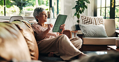 Buy stock photo Senior, woman or thinking with tablet on sofa for online news, reading ebook or internet browsing. Retirement, old person or relax with digital tech in home for streaming subscription or social media
