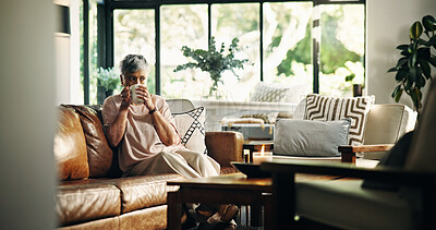 Buy stock photo Senior woman, coffee and thinking on sofa in home, memory or reflection for nostalgia in living room. Person, tea cup and perspective with beverage, drink and remember on couch in retirement at house
