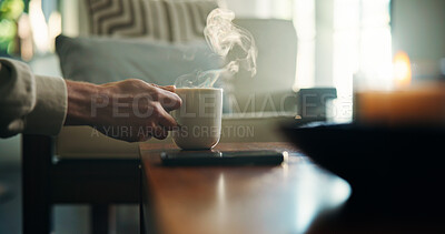 Buy stock photo Hand, tea and person in house with steam, warm drink for thirst and relax with herbal beverage in living room. Break, calm and mug on table with hot coffee, espresso or fresh brew in home lounge