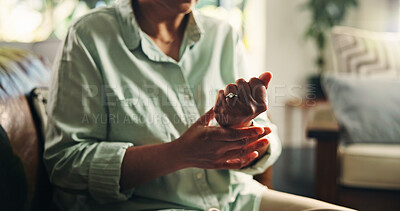 Buy stock photo Wrist pain, hands and injury with old woman on sofa for osteoporosis, arthritis and emergency. Parkinson cramp, mobility risk and anatomy with senior person in living room of home for fibromyalgia