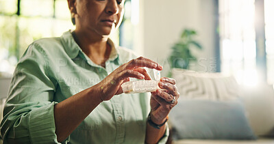 Buy stock photo Pills, container and hands with senior woman for daily dose, healthcare and medicine at home. Health, wellness and female person with box for vitamins, drugs or pharmaceutical help in living room