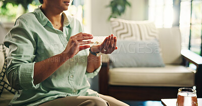 Buy stock photo Pills, container and hands with mature woman for daily dose, healthcare and medicine at home. Health, wellness and female person with box for vitamins, drugs or pharmaceutical help in living room