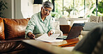 Mature woman, remote work and document for finance, budget review or asset management. Reading, freelancer and serious person with paper in living room for accounting, insurance or expenses in home