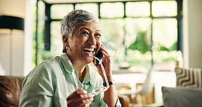 Buy stock photo Mature woman, laugh and phone call on sofa in home with glasses, talk and funny chat in lounge. Person, smartphone and excited for comic story, gossip or conversation on couch in living room at house