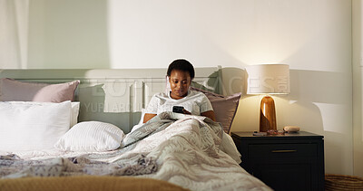 Buy stock photo Reading, phone and wake up with black woman in bedroom for chat, notification and morning routine. Relax, social media and wellness with person in home for contact, typing and online news update