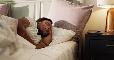 Buy stock photo Home, dream and black woman with sleeping in bed for resting, tired and comfortable on pillow. Exhausted, person and asleep in bedroom for weekend break, relax and recovery from fatigue in apartment
