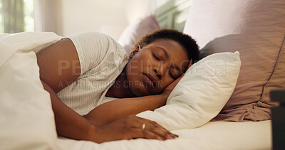 Buy stock photo Tired, dream and black woman with sleeping in bed for resting, peaceful and comfortable on pillow. Exhausted, person and asleep in home for lazy weekend, relax and recovery from fatigue in bedroom