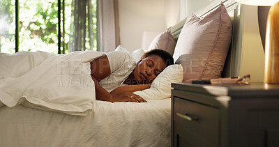 Buy stock photo Home, tired and black woman with sleeping in bed for resting, dreaming and comfortable on pillow. Exhausted, person and asleep in bedroom for lazy weekend, relax or recovery from fatigue in apartment