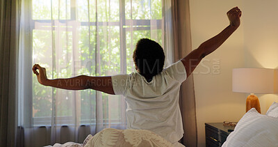 Buy stock photo House, back view and black woman stretching in bed for health, wellness or resting routine in morning. Curtains, relax and person waking up lazy in apartment with comfort, pyjamas and calm with peace
