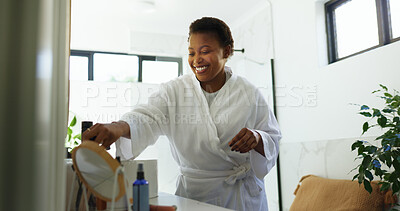 Buy stock photo Happy, home and black woman in morning in bathroom for cleaning, washing face and grooming. Daily routine, beauty and person with products for skincare, hygiene and wellness for health in house