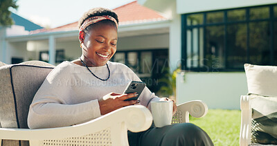 Buy stock photo Happy, coffee and black woman with phone in backyard on break, social media and online blog. Beverage, outdoor and female person with mobile app for text, notification or reading review on website