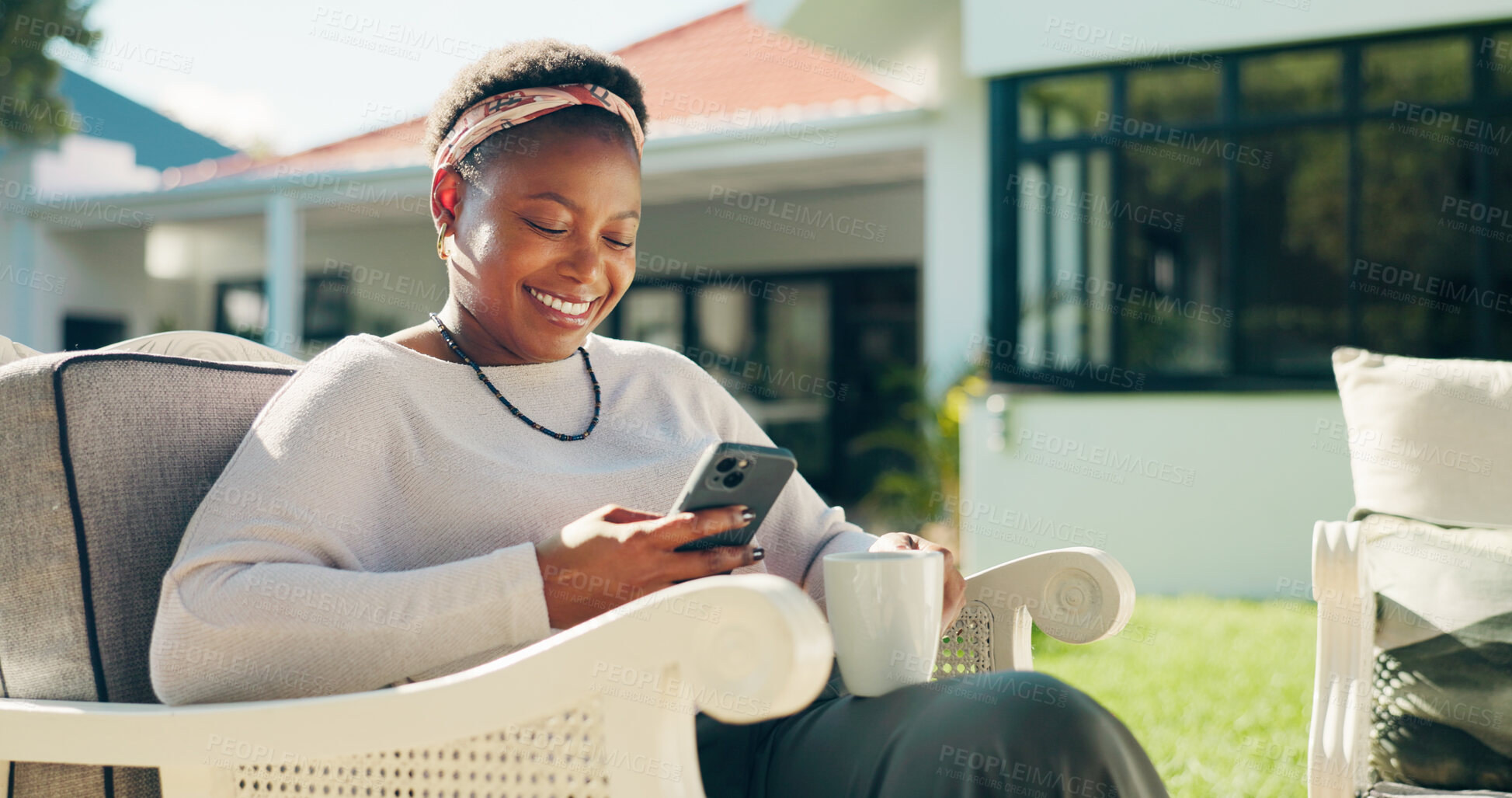 Buy stock photo Happy, coffee and black woman with phone in backyard on break, social media and online blog. Beverage, outdoor and female person with mobile app for text, notification or reading review on website