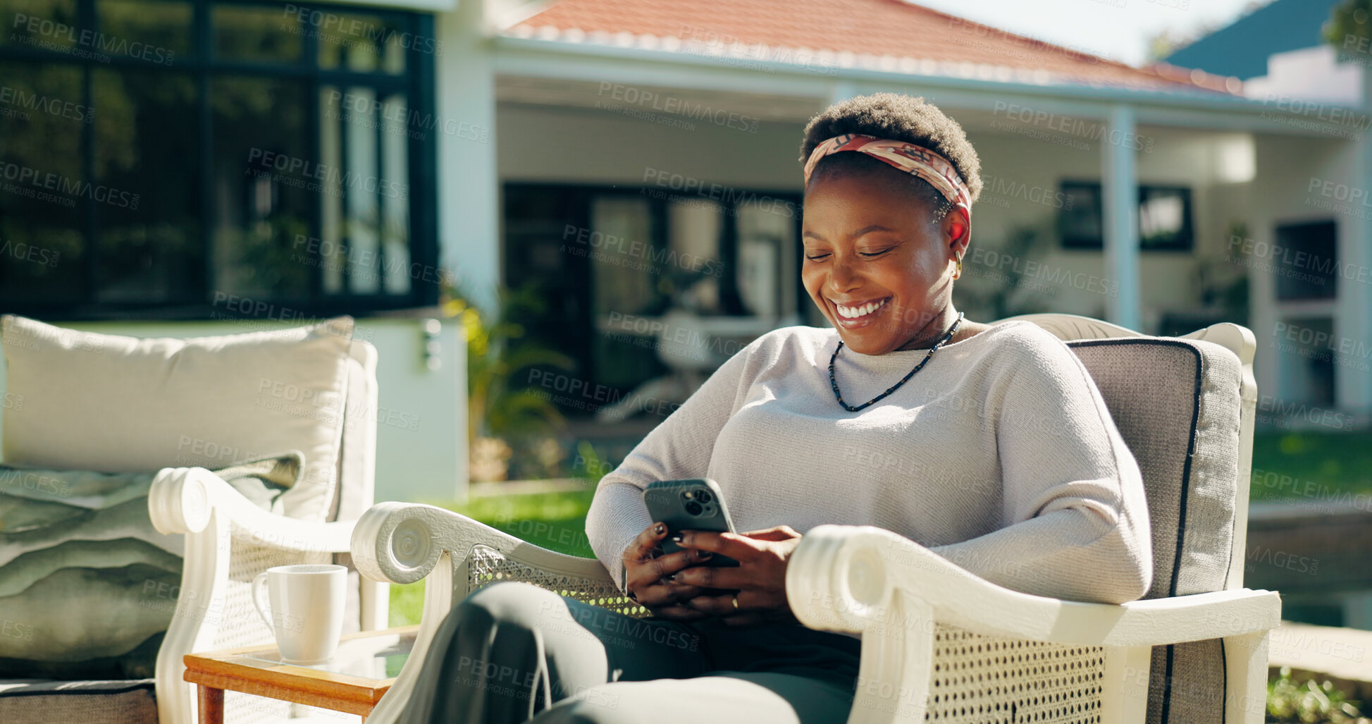 Buy stock photo Backyard, laugh and happy black woman with phone on social media or online review. Guest house, outdoor and female person with funny meme for text, news feedback or reading accommodation website