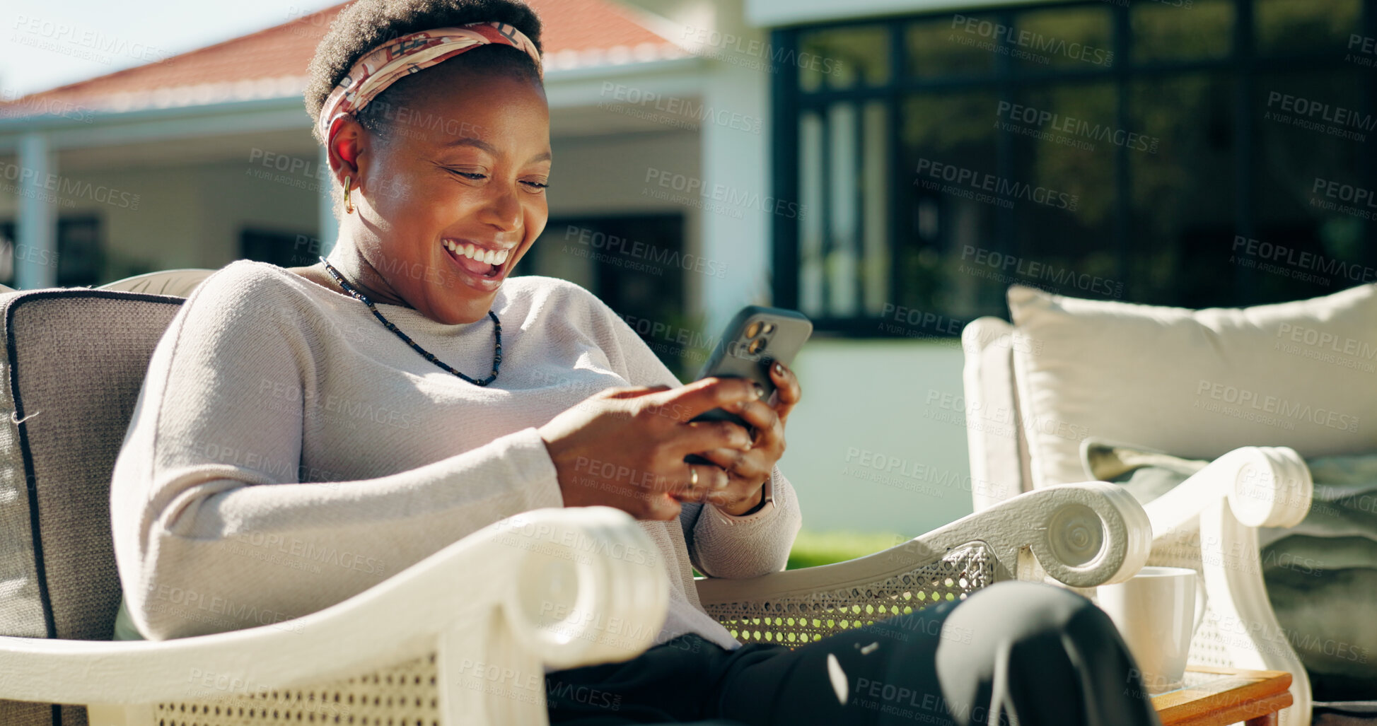 Buy stock photo Happy, laugh or black woman with phone in guest house on holiday, social media or online review. Funny meme, outdoor or female person with mobile for text, feedback or reading accommodation website