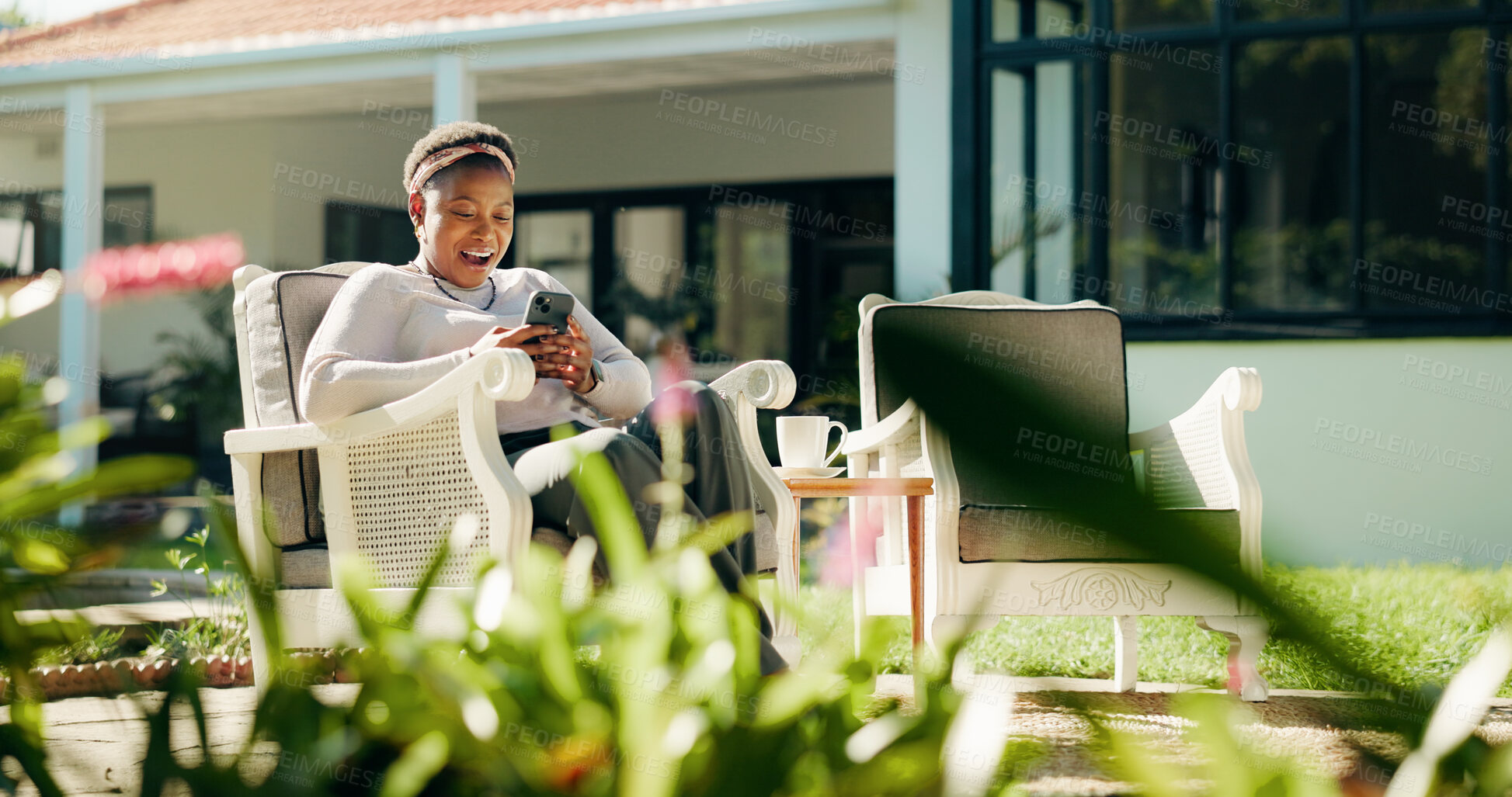 Buy stock photo Reading, surprise or black woman with phone in backyard on social media story or online blog. Guest house, outdoor or shocked person with mobile for fake news or discount on accommodation website