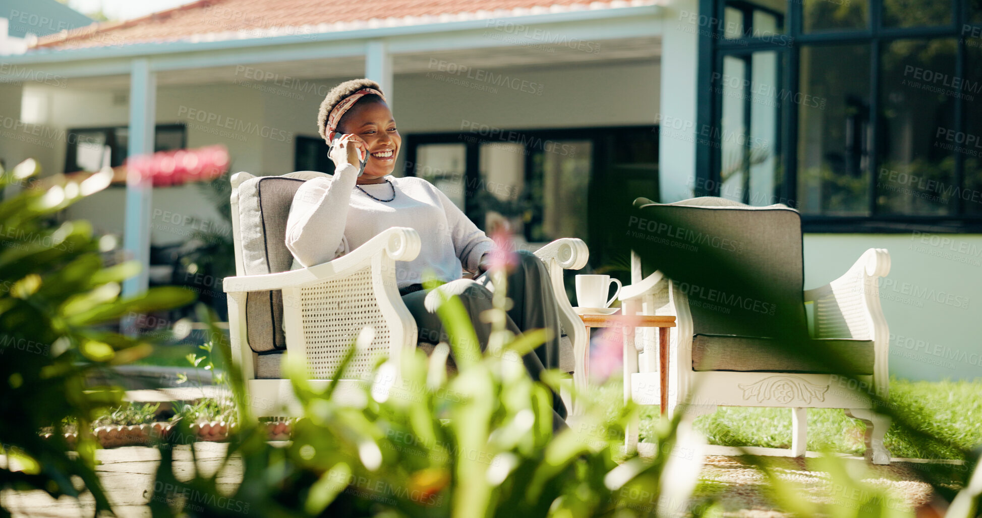 Buy stock photo Phone call, relax and black woman in backyard for talking, contact and connection in house. Weekend, garden and happy person outdoor on smartphone for communication, networking and conversation