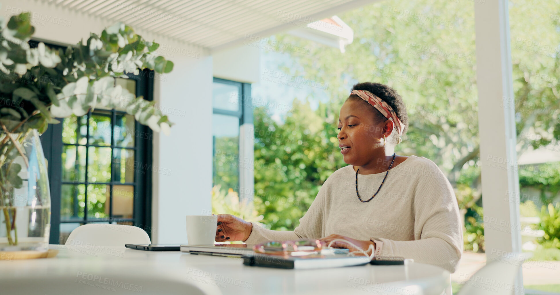Buy stock photo Black woman, coffee and mug with drink on outdoor table for morning caffeine or beverage at home. Female person, freelancer or remote worker with cup or technology for break or fresh start at house