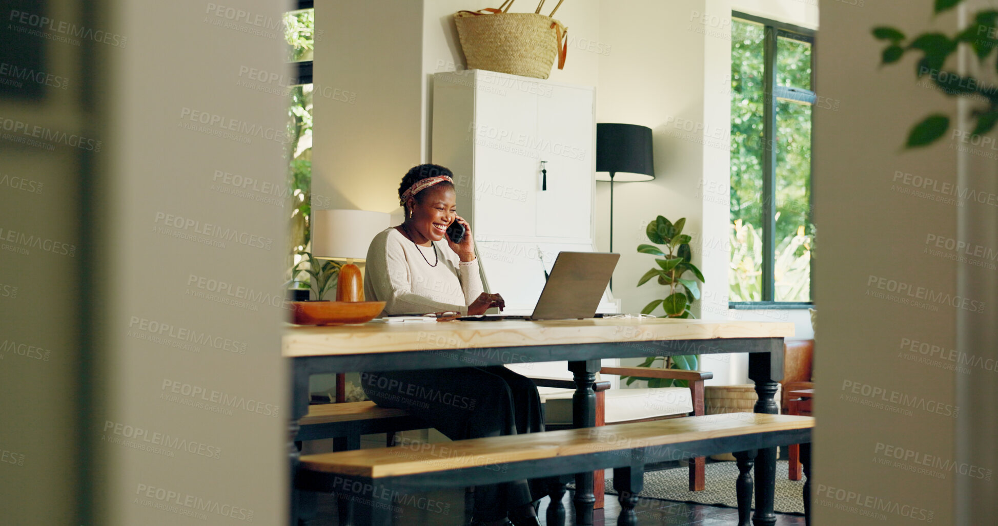 Buy stock photo Phone call, laptop and black woman laugh for remote work, virtual assistance and consulting. Happy, house and person on computer talking on smartphone for communication, contact and online planning