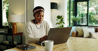 Buy stock photo Freelancer, black woman and typing on laptop in home for blog post, creative review or publication. Remote work, journalist or tech in house for writing newsletter, story development or editing draft