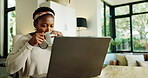 Black woman, drink and coffee with laptop at house for remote work, review article and proofreading. Female freelancer, beverage and online for research, story feedback and news update of publication
