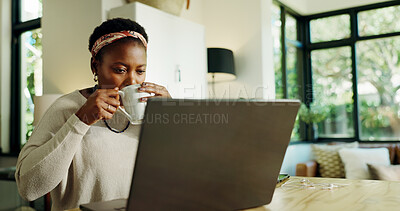 Buy stock photo Black woman, drink and coffee with laptop at house for remote work, review article and proofreading. Female freelancer, beverage and online for research, story feedback and news update of publication