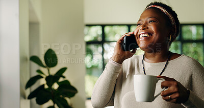 Buy stock photo Black woman, phone call and laugh in home with coffee, conversation and listen in living room. African person, happy and smartphone for chat, joke and tea cup with funny discussion at apartment