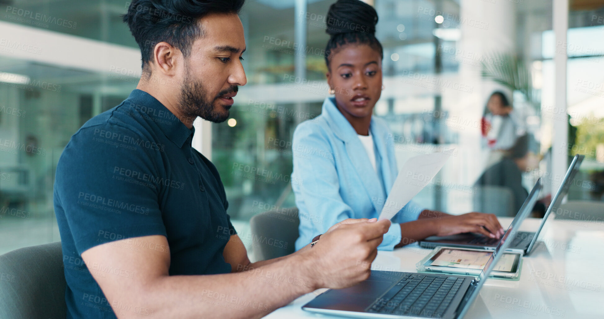Buy stock photo Office, colleagues and people with document, reading and account manager with financial performance. Collaboration, man and woman with paperwork for sales, serious and review of report or laptop