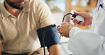 Blood pressure, hands and doctor with person in clinic for medical exam, checkup and consulting. Healthcare, hospital and patient with equipment to monitor for heart rate, wellness and hypertension
