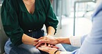 Psychologist, patient and holding hands in therapy consultation for empathy, advice or psychology. Clinic, women and comfort in counseling for mental health support, compassion and trauma healing
