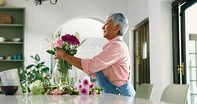Buy stock photo Elderly woman, bouquet and flowers at house for special occasion, aesthetic and natural bloom. Senior person, arrangement and plant care with floral beauty, hospitality decoration and setup of resort