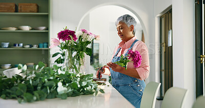 Buy stock photo Old woman, florist and flowers in vase at house of special occasion, aesthetic and natural bloom. Senior person, arrangement and plant care of floral bouquet, hospitality decoration and resort setup