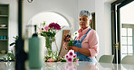 Old woman, florist and cutting flowers at house of special occasion, aesthetic and natural bloom. Senior person, arrangement and plant care of floral bouquet, hospitality decoration and resort setup
