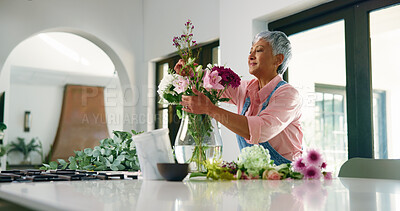 Buy stock photo Vase, flowers and senior woman with bouquet, retirement and natural with decorations. Pensioner, apartment and elderly person with gift, plants and hobby with happiness, blooming and house with break
