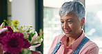 Senior woman, bouquet and flowers at house for special occasion, aesthetic and natural bloom. Elderly person, arrangement and plant care with floral beauty, hospitality decoration and setup of resort