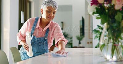 Buy stock photo Senior woman, spring cleaning and wipe surface for hygiene, chores and housekeeping in home. Housework, person and table disinfection with cloth for bacteria, dirt and germ prevention in retirement