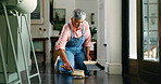 Mature woman, sweeping and cleaning floor in home for dirt removal, housekeeping and maintenance. Housework, cleaner and dustpan in house to pickup trash, hygiene and domestic chores for cleanliness
