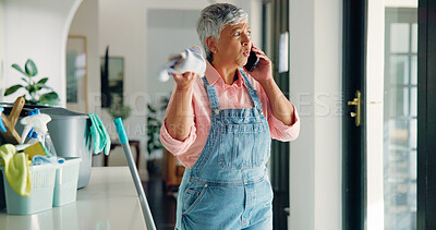 Buy stock photo Senior woman, cleaning and argument with phone call for housekeeping or domestic service at home. Female person, maid and cleaner talking on mobile smartphone for disagreement or dirty mess at house