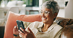 Mature woman, phone and smile on sofa with funny post, texting and notification on web in home. Person, smartphone and happy with mobile app, laugh and relax with social media on couch at apartment