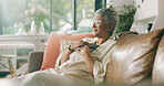 Smile, relax and phone with old woman on sofa for social media news, update and text message. Calm, reflection and online chat with senior person in living room of home for communication app