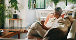 Old woman, relax and reading a book on sofa for knowledge, literature story and retirement hobby. Senior, person and best seller novel in home for fantasy fiction, leisure activity and weekend break