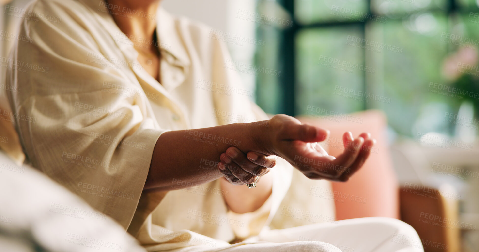 Buy stock photo Hands, arthritis and woman with wrist pain on sofa for joint injury, inflammation and massage. Carpal tunnel, person and sprain in home for fibromyalgia and muscle fatigue from osteoporosis disease