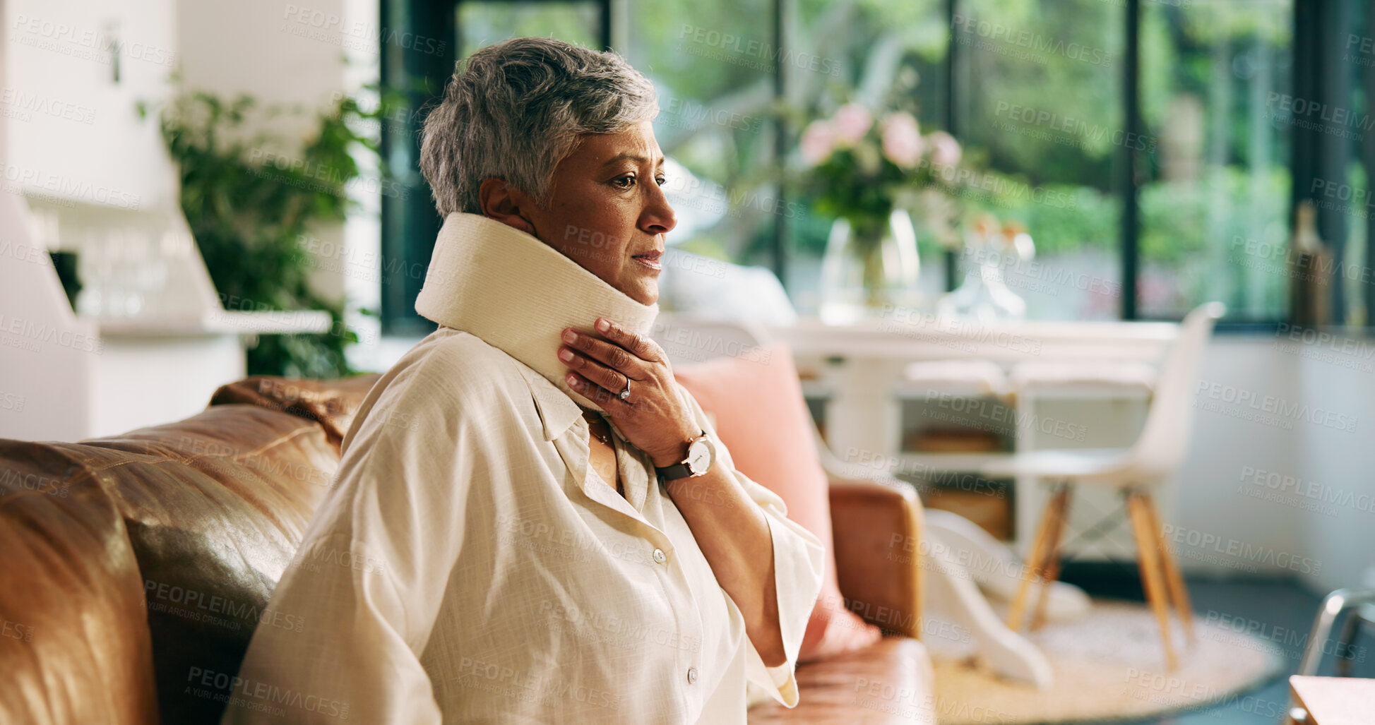 Buy stock photo Home, injury and woman with neck brace, thinking and discomfort of fracture, pain or hurt in lounge. Accident, recovery and C collar to support spinal cord, house and healthcare for elderly person