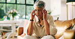 Headache, stress and senior woman on sofa in home with fatigue, tension or brain fog in living room. Burnout, migraine and female person with discomfort for dizziness, exhaustion or vertigo in house