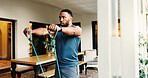 Fitness, man and resistance band to workout muscle for strength, energy or power at home. Stretching, wellness and strong person with equipment for training, exercise arms and bodybuilding for health